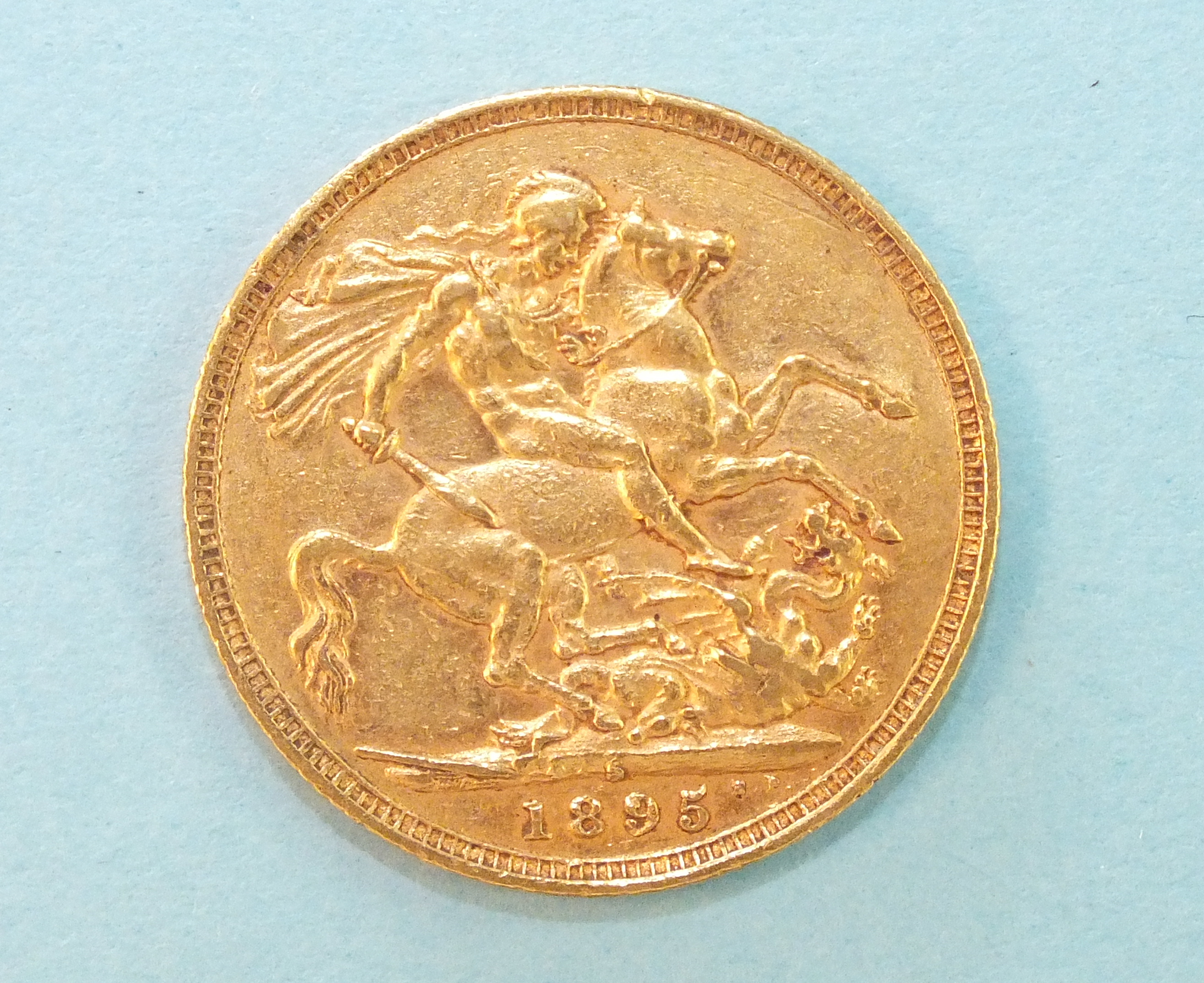 A Queen Victoria 1895 gold sovereign.