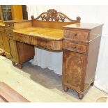 An early-19th century mahogany pedestal sideboard, having an arrangement of drawers and cupboard