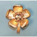 A 9ct gold brooch/pendant in the form of a dog rose, with five textured petals around the centre set