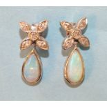 A pair of opal and diamond earrings, each with diamond-set quatrefoil above an opal pear-shaped