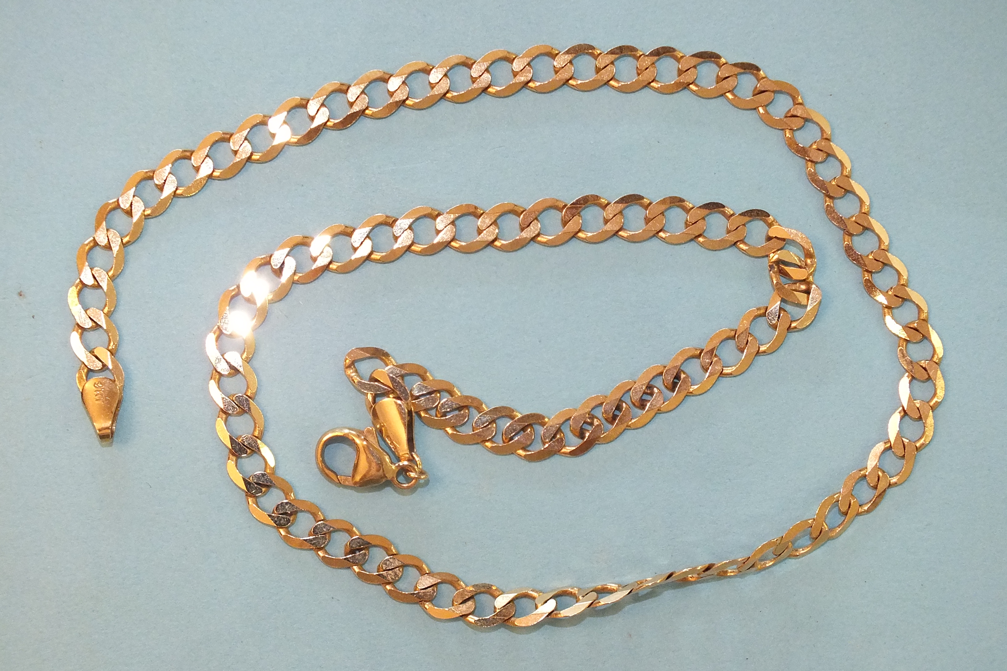 A 9ct gold watch chain of flattened curb links, 45.5cm, 13g.