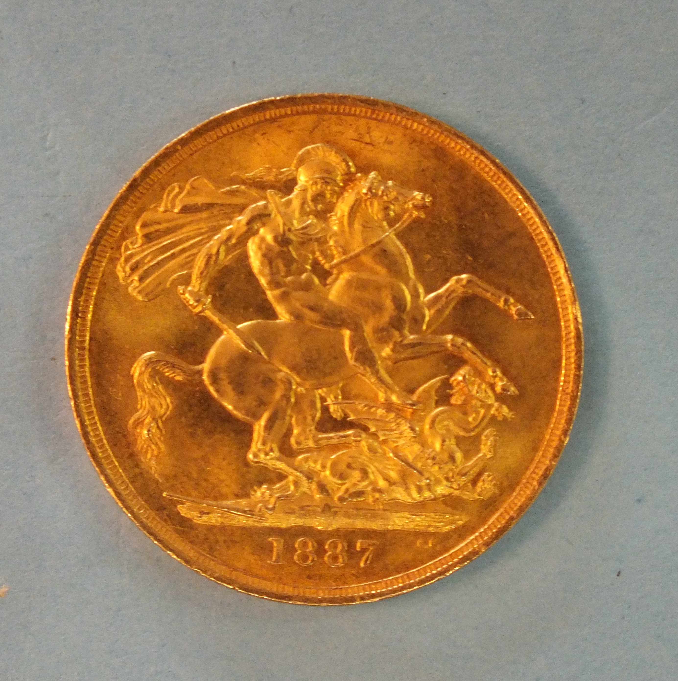 A Queen Victoria 1887 gold two-pound.