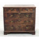 An 18th century mahogany chest of two short and three long cross-banded drawers, on later bracket