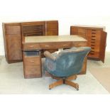 A mid-20th century walnut-veneered knee-hole desk, fitted with nine drawers, 136cm wide, 74.5cm