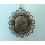 A cased mounted silver coin from the Lucayan Beach Pirate Treasure, set in a white metal mount,