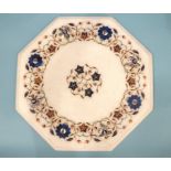 An octagonal white marble table top inlaid with foliate design of lapis lazuli, mother-of-pearl