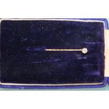 A diamond stick pin, claw set a brilliant cut diamond (0.2cts approx.).