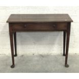 An antique oak side table, the rectangular top above a frieze drawer, on turned legs with pad