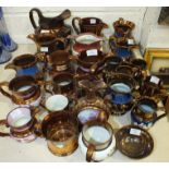 A collection of copper lustre jugs, mugs, etc, (some a/f).