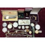 A collection of metal pocket watches, a steel heart-shaped fob watch and other items.