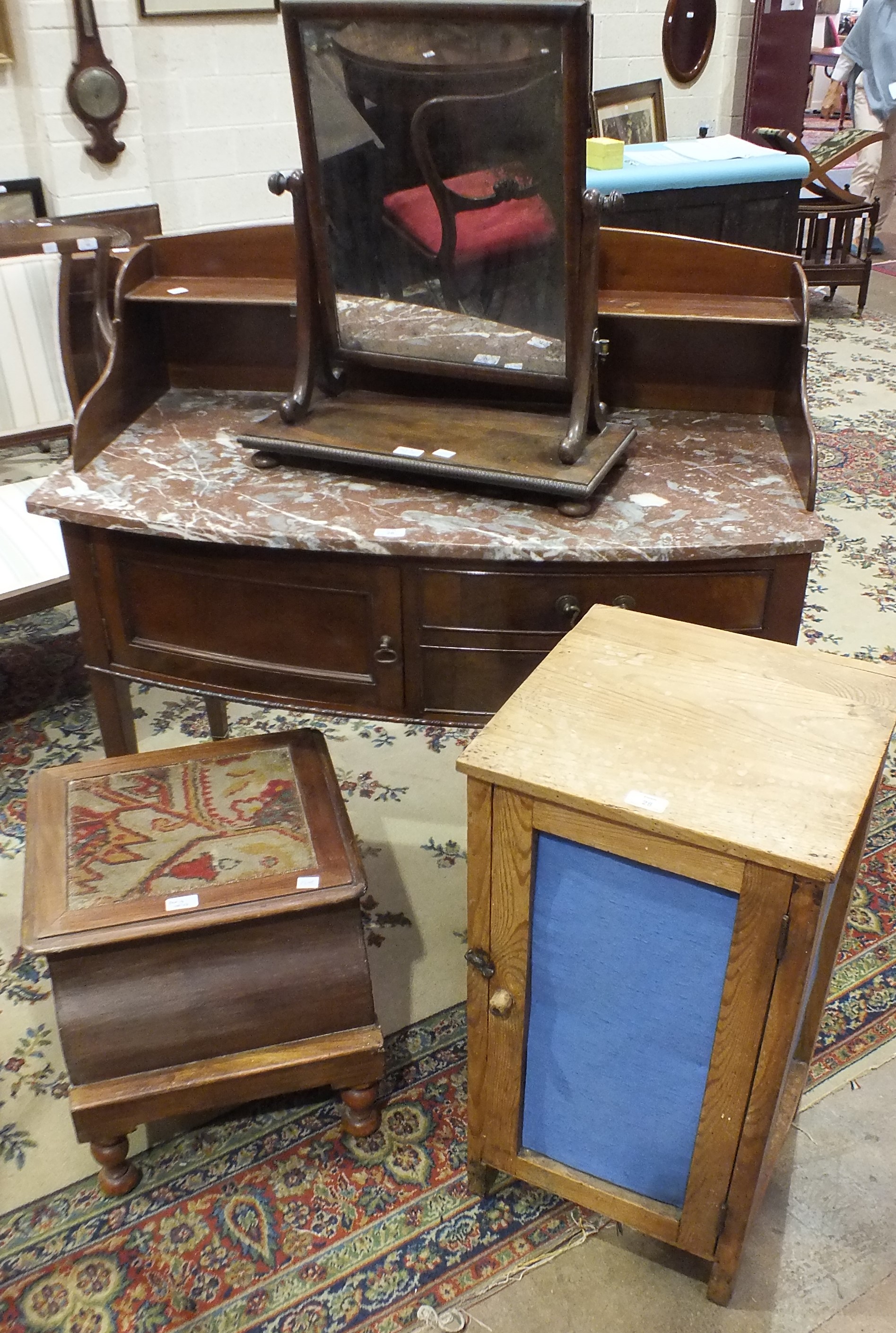 A bow-fronted marble-top wash stand, a mahogany swing dressing table mirror, a commode and other