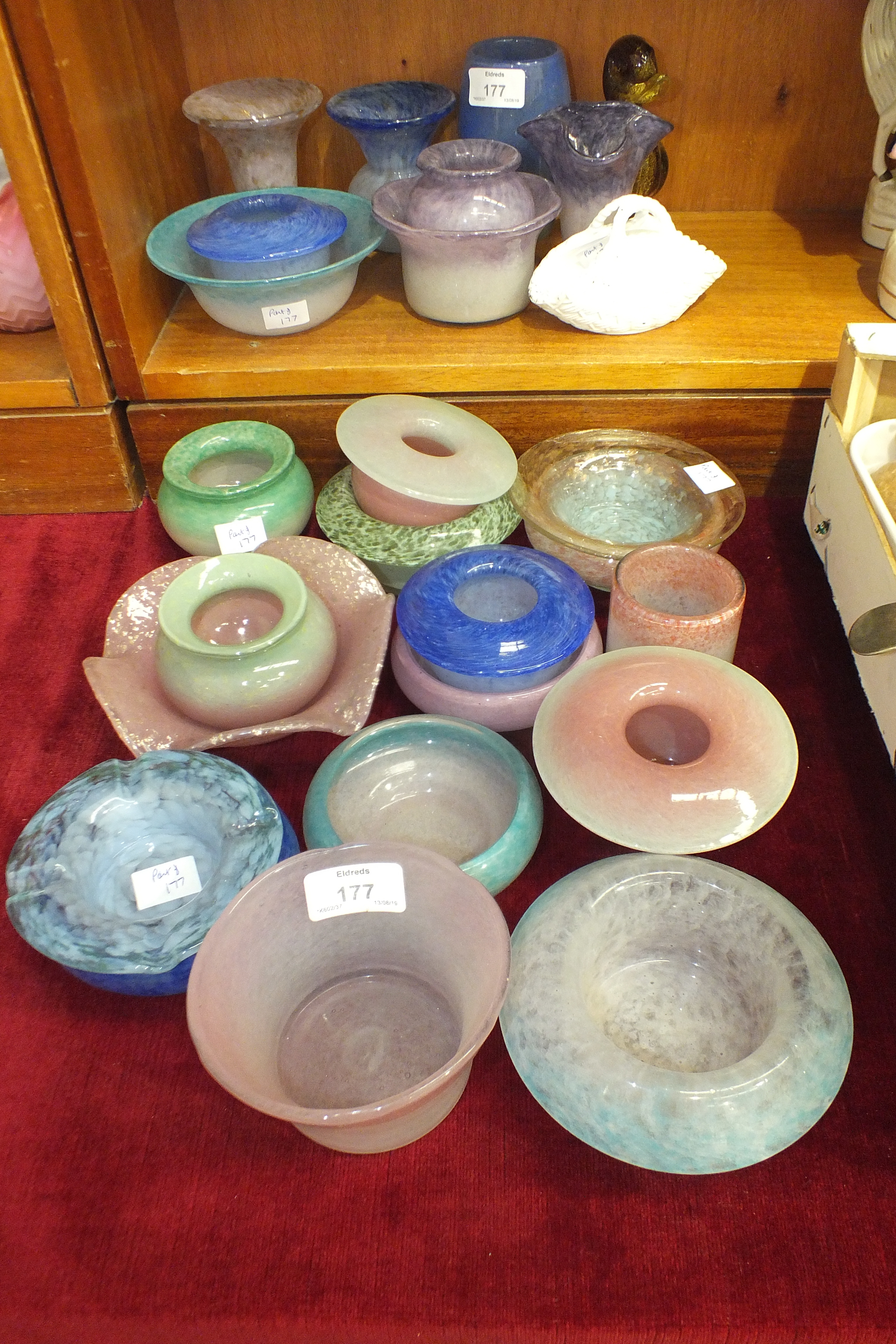A collection of Vasart coloured glass bowls, posy holders and small vases, approximately 22 pieces.