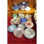 A collection of Vasart coloured glass bowls, posy holders and small vases, approximately 22 pieces.