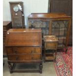 An oak display cabinet, 120cm wide, an oak bureau, a needlework table and an oak grandmother clock