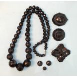 A Victorian necklace of faceted graduated jet beads, (two largest a/f), 103g and other jet items.