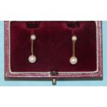 A pair of cultured pearl drop earrings, each pearl stud supporting a slightly-larger pearl drop,