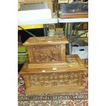 A modern carved hardwood lidded box, 66cm wide and another smaller box carved with African