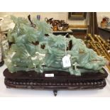 A mid-20th century Oriental 'jade' carving of five galloping horses, on wooden stand, in box, the