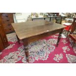 A 19th century pine kitchen table on turned legs, 136 x 76cm, (drawer lacking) and a stained wood