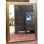 A large modern gilt frame hanging wall mirror, 105 x 138cm.