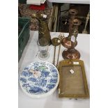 A pair of plated copper candlesticks, 30cm high, a "Homestead Series" brass military photo frame