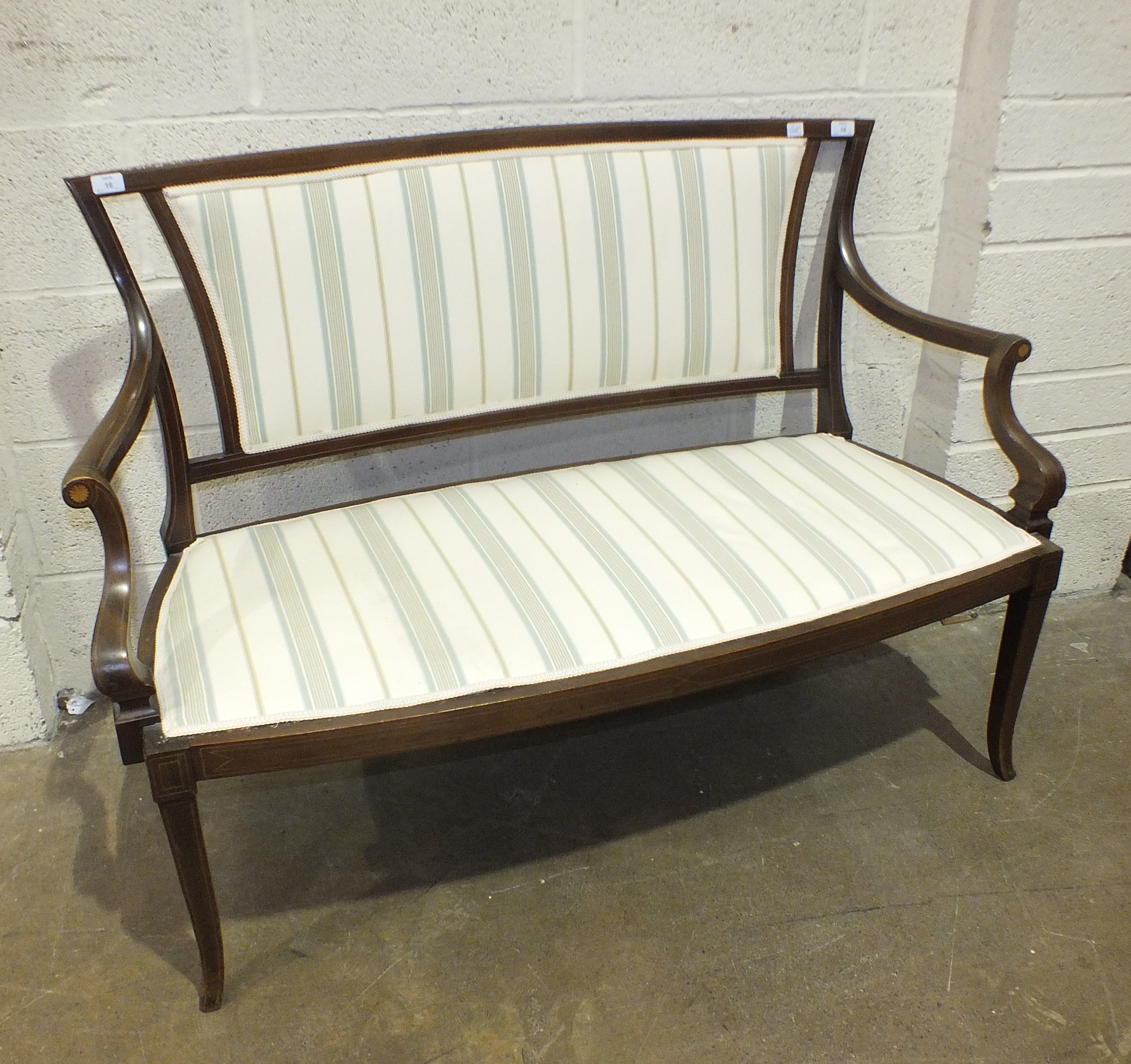 An Edwardian inlaid mahogany hall seat, 130cm wide.