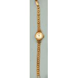 A lady's wrist watch, (a/f) with 9ct gold case and bracelet, total weight 12.1g.