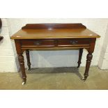 A Victorian mahogany side table, the rectangular top above two frieze drawers, on turned legs with