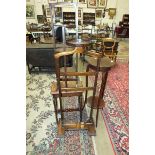 A stained pine stool, a mahogany plant stand, an oak valet stand, (top damaged) and a cake stand, (