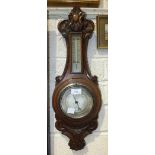 An oak-cased aneroid barometer/thermometer, the dial marked Adams, Dartmouth, 61cm, an oak three-