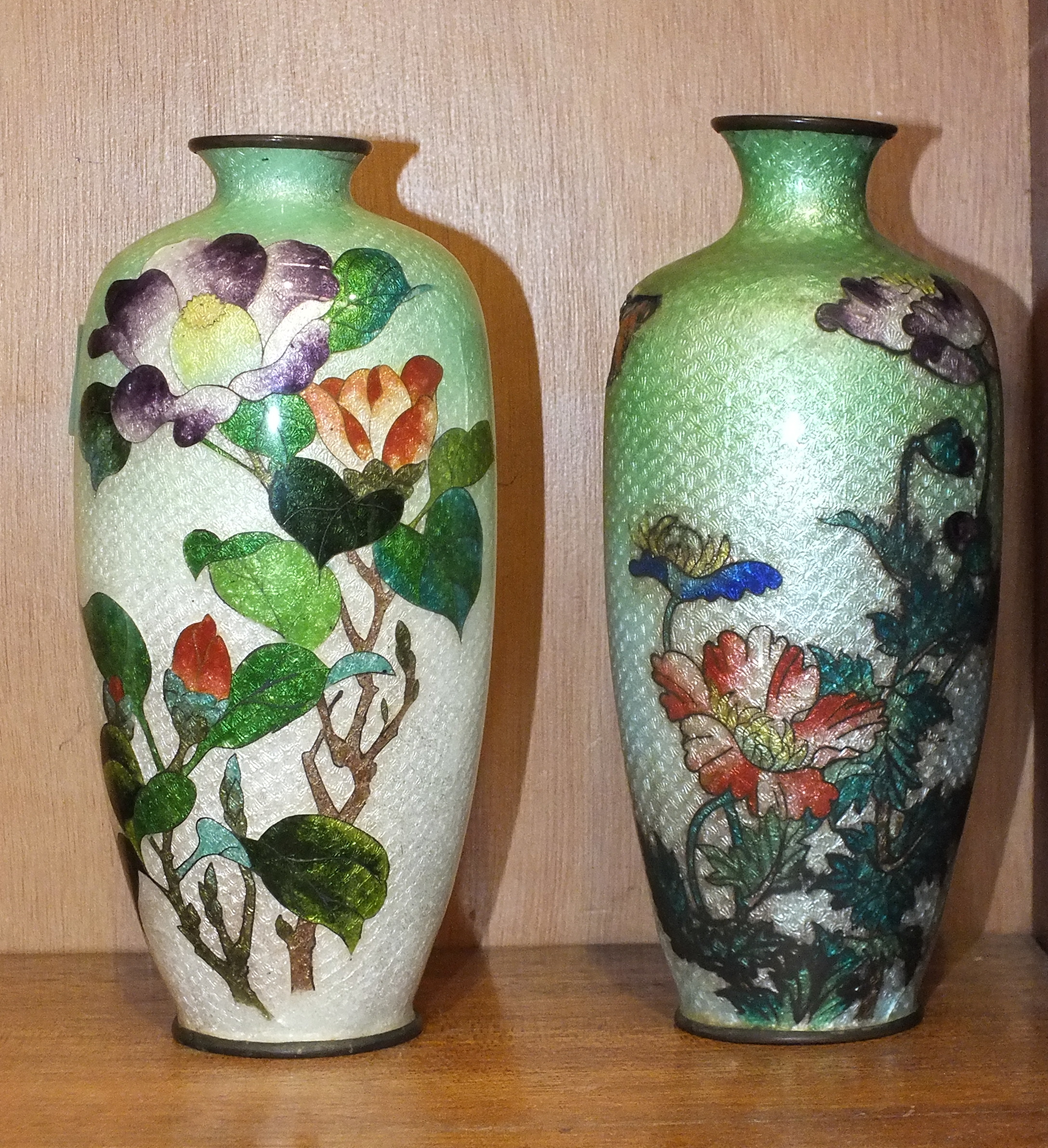 Two cloisonné ovoid shape vases in the ginbari style, decorated with flowers and leaves, 17cm