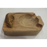 A Robert "Mouseman" Thompson oak ashtray with carved mouse signature, 10 x 7.5cm.