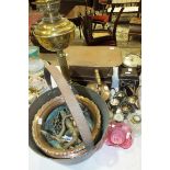 A brass oil lamp, a brass skillet and miscellaneous items.