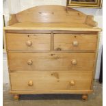 A stripped pine chest of drawers, the rectangular tray top above two small and two long drawers,