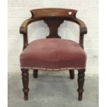 A mahogany library tub chair with upholstered seat, on turned legs.