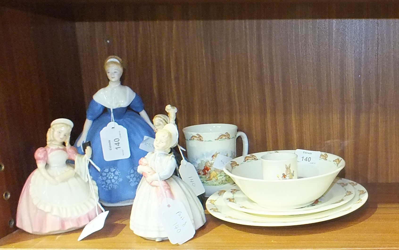 Four Royal Doulton figurines, 'Nina' HN2347, 19cm high, 'The Rag Doll' HN2142, 13cm, 'Mother's Help'