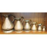 A harlequin set of six graduated copper measures, 1 gallon - ½ gill, the pint measure stamped Burt