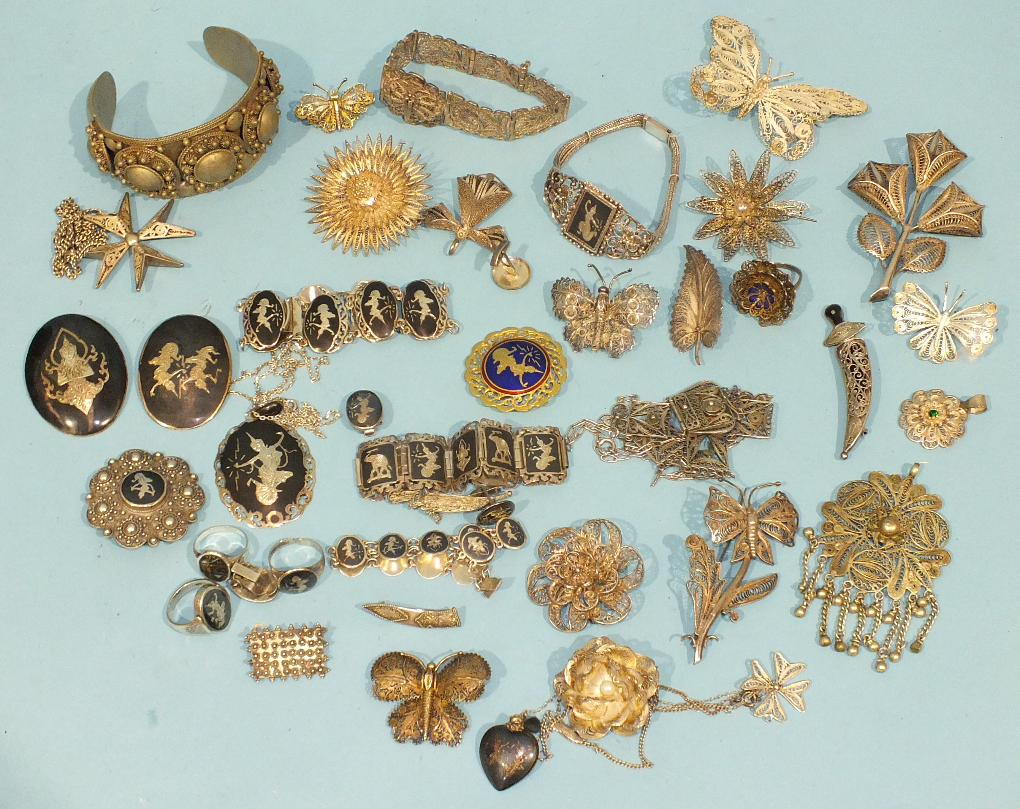 A quantity of silver and white metal filigree jewellery, including several butterfly brooches and