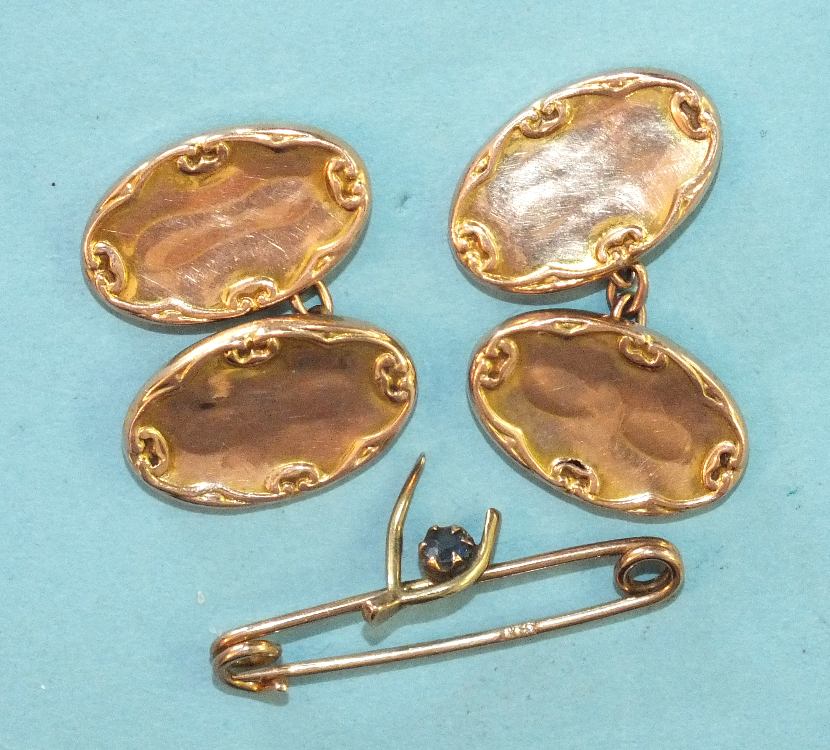A pair of 9ct gold cufflinks and a small 9ct gold wishbone ring, 4g, (2).