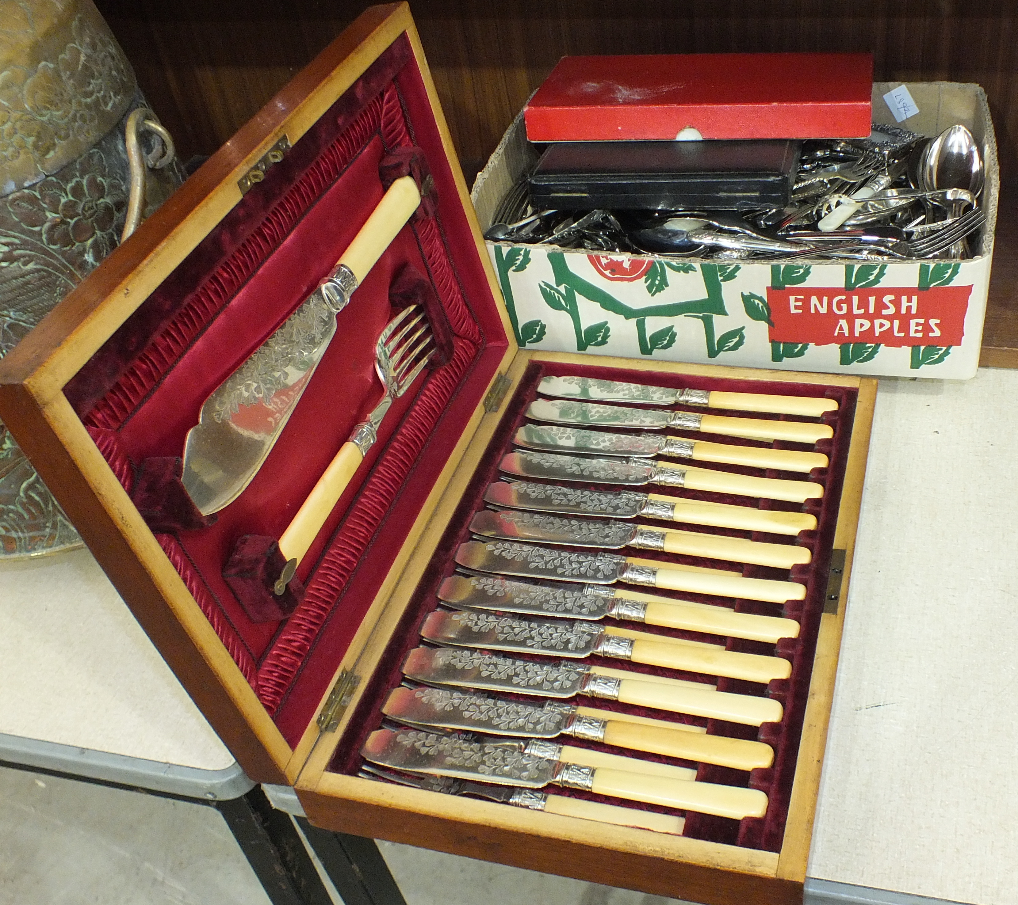 A cased set of twelve each fish knives and forks with servers and a quantity of plated cutlery.