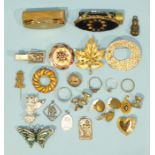 A sterling silver British Empire Exhibition 1924 badge, a small Victorian pendant, etc.