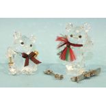 Two Swarovski crystal models: Kris bear with skis and Kris bear holding a Champagne bottle and