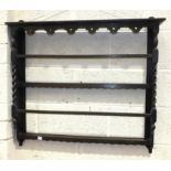 An oak wall plate rack, 90cm wide, 80cm high.