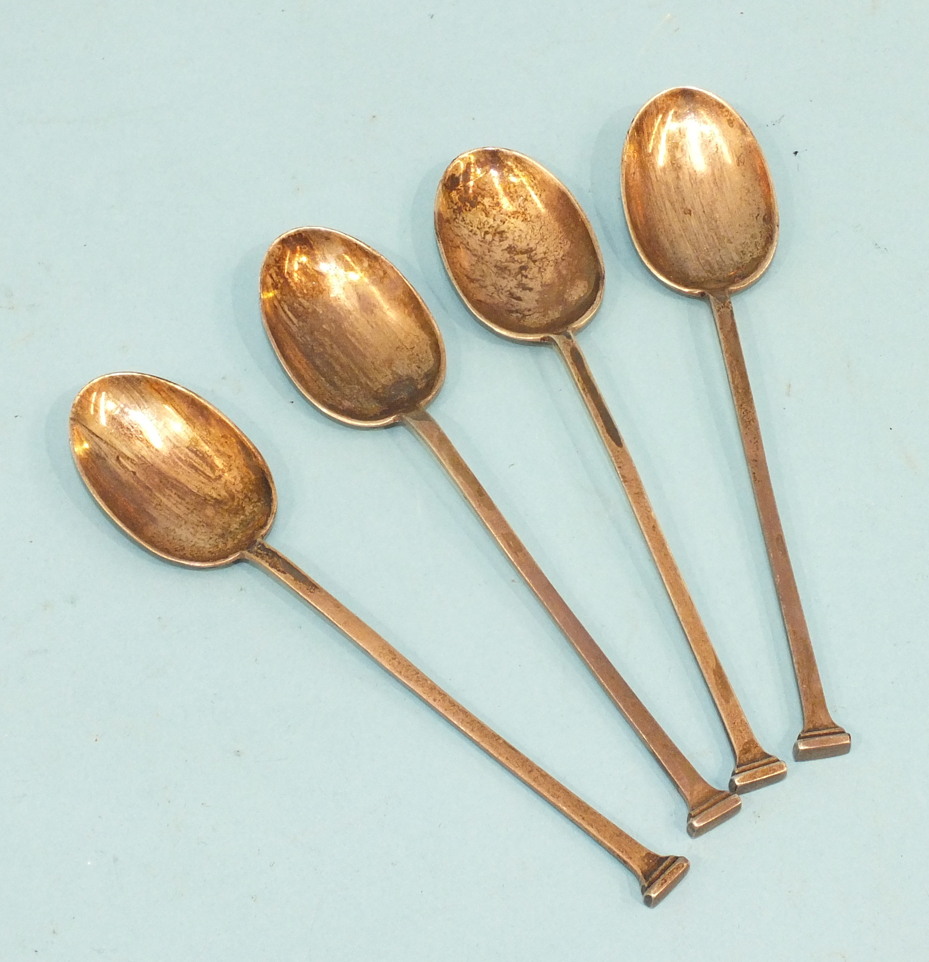 Four silver seal-top coffee spoons by Mappin & Webb.