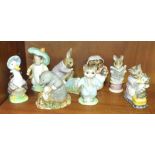 A collection of eight Beswick Beatrix Potter figures, including 'Tabitha Twitchett & Miss