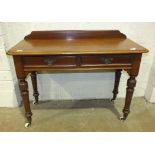 A Victorian mahogany side table, the rectangular top above two frieze drawers, on turned legs with