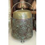 A copper coal box of circular tapering form, embossed with the Dutch coat of arms and a rural