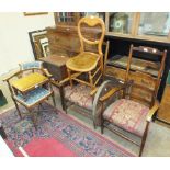 Two wood frame armchairs, a corner chair, a trunk stand and other items.