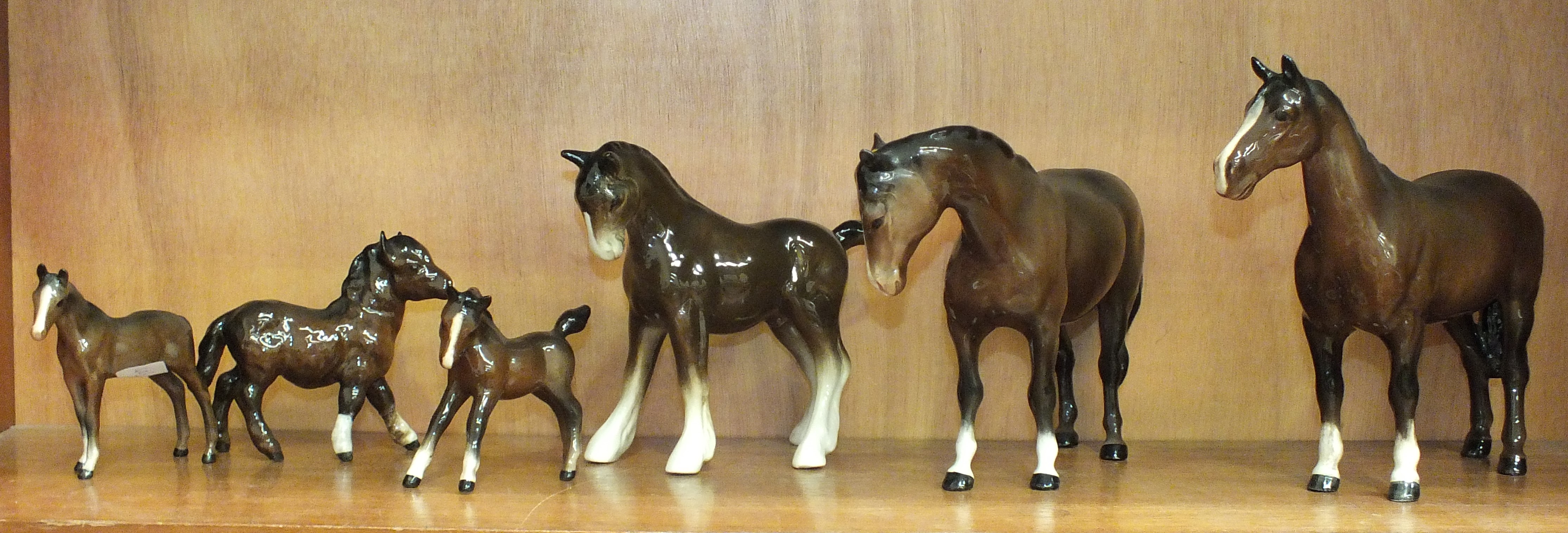 A collection of five Beswick and one Coopercraft horses and foals, (5).