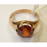 A 9ct gold ring set orange zircon (chipped), size P, 5g.